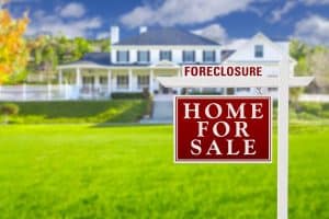 Foreclosure Home For Sale Real Estate Sign in Front of Beautiful